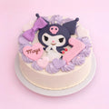 A round birthday cake decorated with a Kuromi character topper, purple and pink heart-shaped fondant decorations, and a pink number 1, presented on a light pink background.